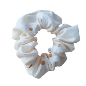 Cream hair scrunchie with daisies