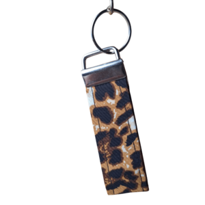 Fabric strap key fob in a striking leopard animal print pattern with silver hardware.