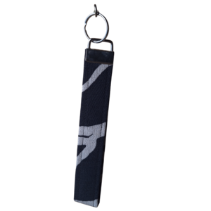 Fabric wristlet keychain strap in a black and beige abstract cloud pattern with a silver clasp.