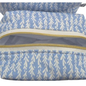Close-up detail of the open top compartment of a white fabric pouch with an all-over blue wildflower print.